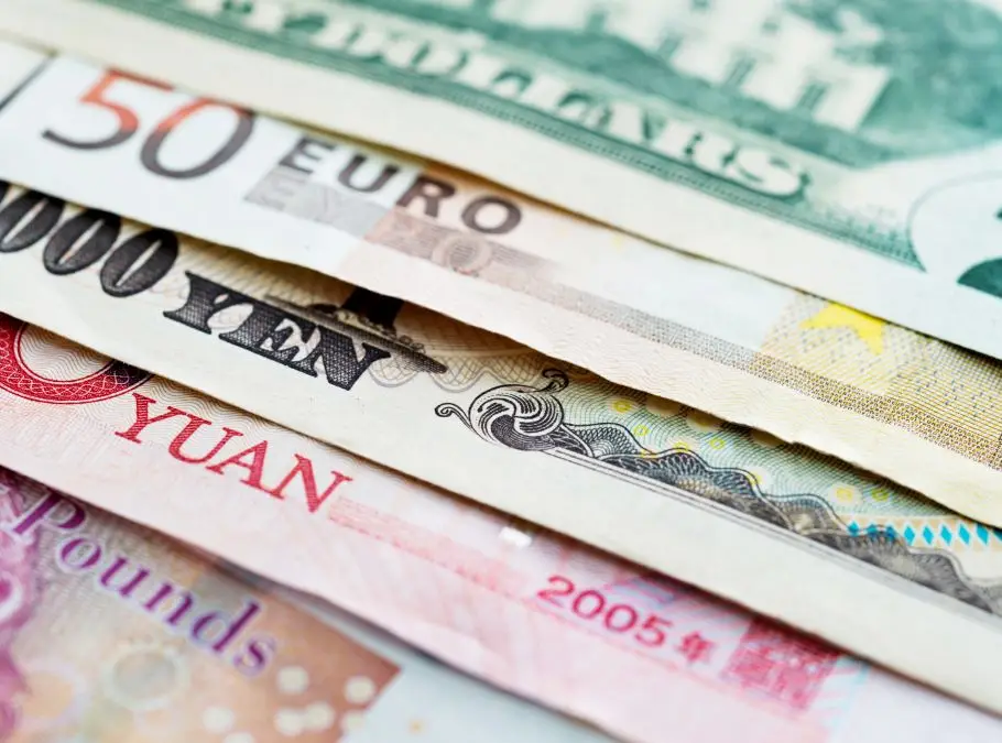 A stack of notes of different currencies, as used by non-resident tax payers